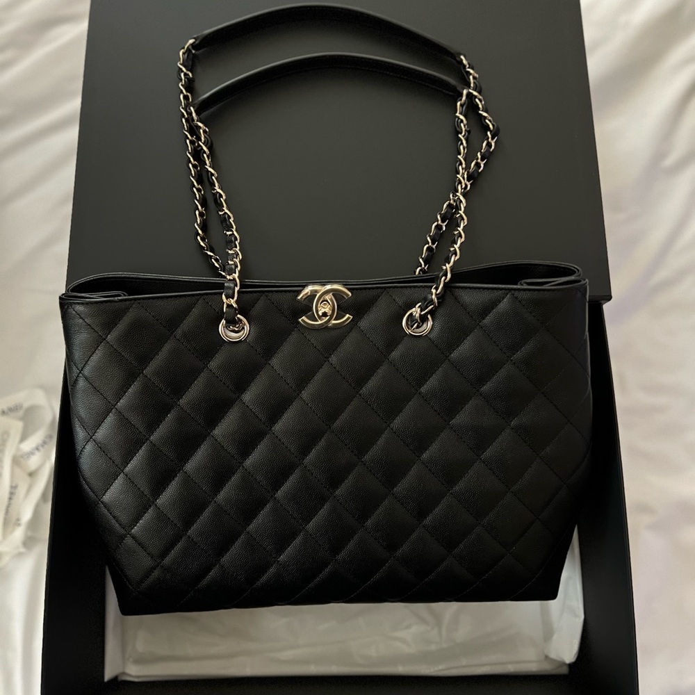 CHANEL Black Shoulder Bag with Quilted Design and Gold-Toned Logo